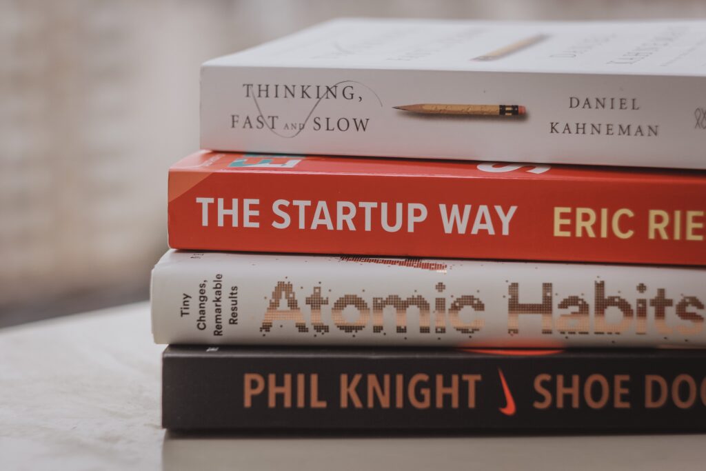 stack of productivity themed books