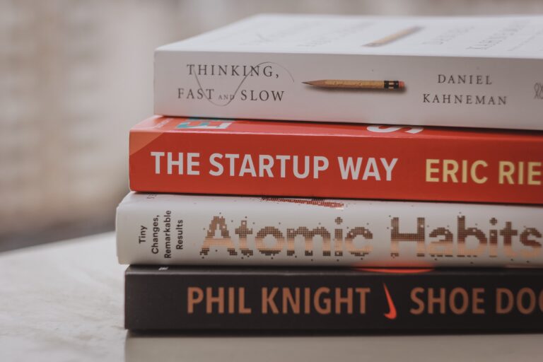 stack of productivity themed books